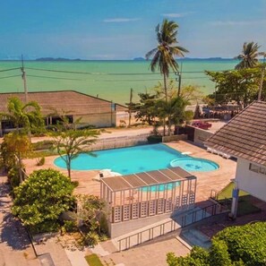 Outdoor pool, open 7:00 AM to 2:00 PM, pool loungers