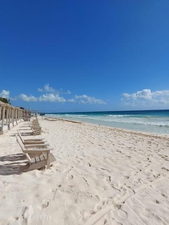 Private beach, white sand, free beach cabanas, sun loungers