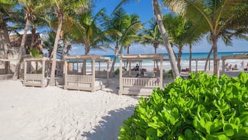 Private beach, white sand, free beach cabanas, sun loungers