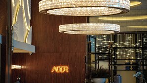 A modern interior with a wooden wall and a neon sign reading "ADOR". - InterContinental Sofia by IHG (Sofia)