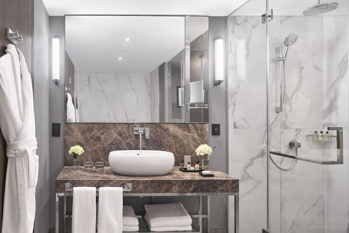 Separate tub and shower, rainfall showerhead, designer toiletries