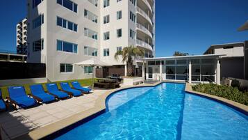 Seasonal outdoor pool, open 9:00 AM to 9:00 PM, pool loungers