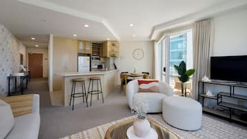 Deluxe-Apartment | Wohnbereich | Flachbildfernseher