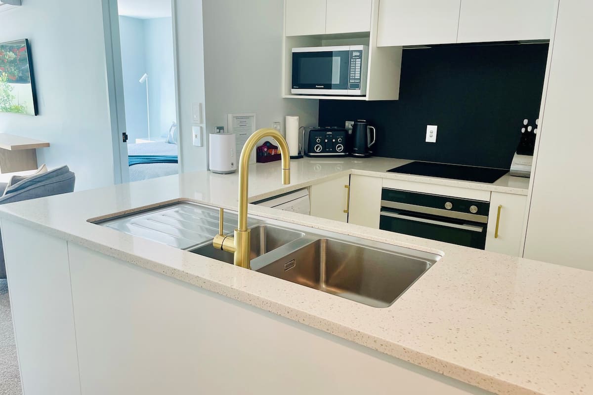 one bedroom courtyard apartment | living area | flat-screen tv