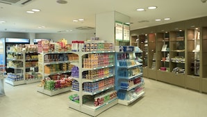 A well-lit grocery store with organized aisles and shelves stocked with various products. - Seorak Pine Resort (Sokcho)