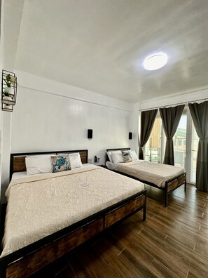 Deluxe Room with Balcony | 1 bedroom, in-room safe, desk, free WiFi