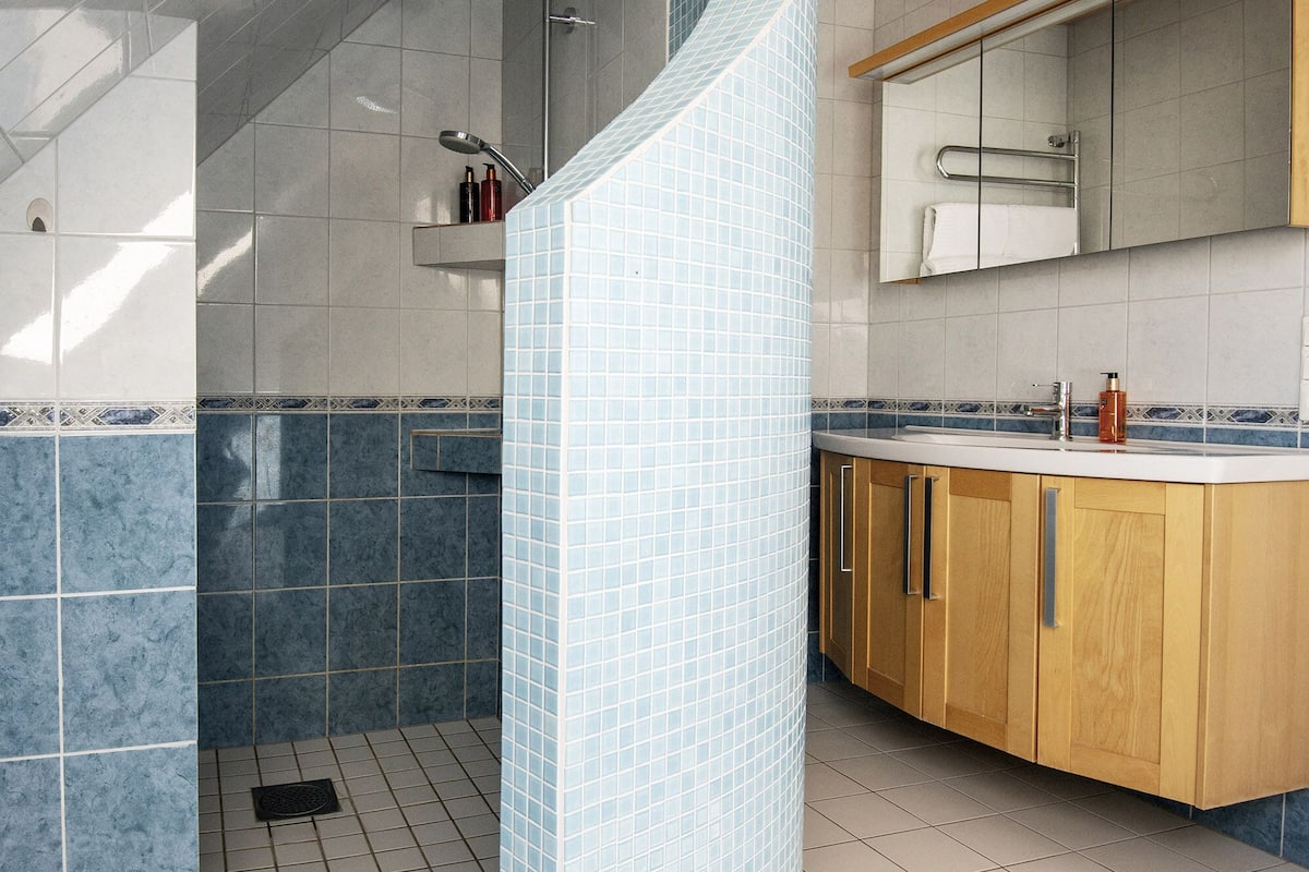 family suite, jetted tub | bathroom | designer toiletries, hair dryer, soap, shampoo