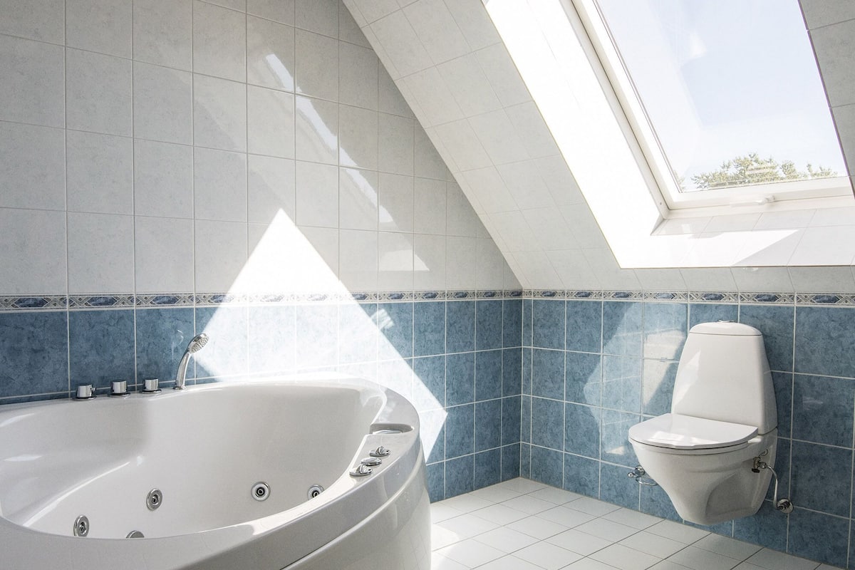 family suite, jetted tub | bathroom | designer toiletries, hair dryer, soap, shampoo