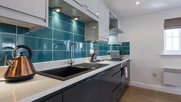 Deluxe Apartment, 2 Bedrooms | Private kitchen | Fridge, microwave, oven, dishwasher