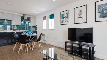 Deluxe Apartment, 2 Bedrooms | Living room | Flat-screen TV