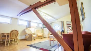 Deluxe Family Room | Living area | Flat-screen TV