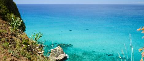 Private beach, white sand, free beach shuttle, beach umbrellas