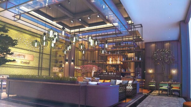 Un moderno vestíbulo de hotel con una zona de bar, asientos y un suelo a cuadros.