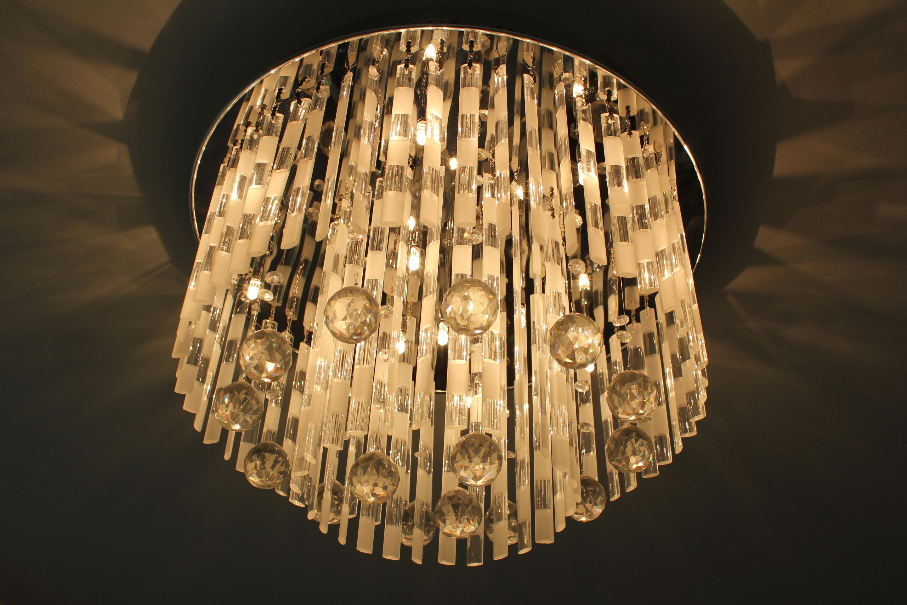 A chandelier with multiple crystal elements and light fixtures.
