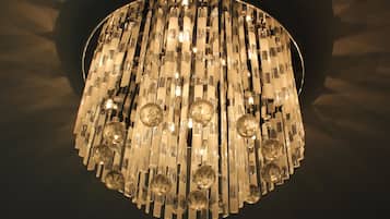 A chandelier with multiple crystal elements and light fixtures.
