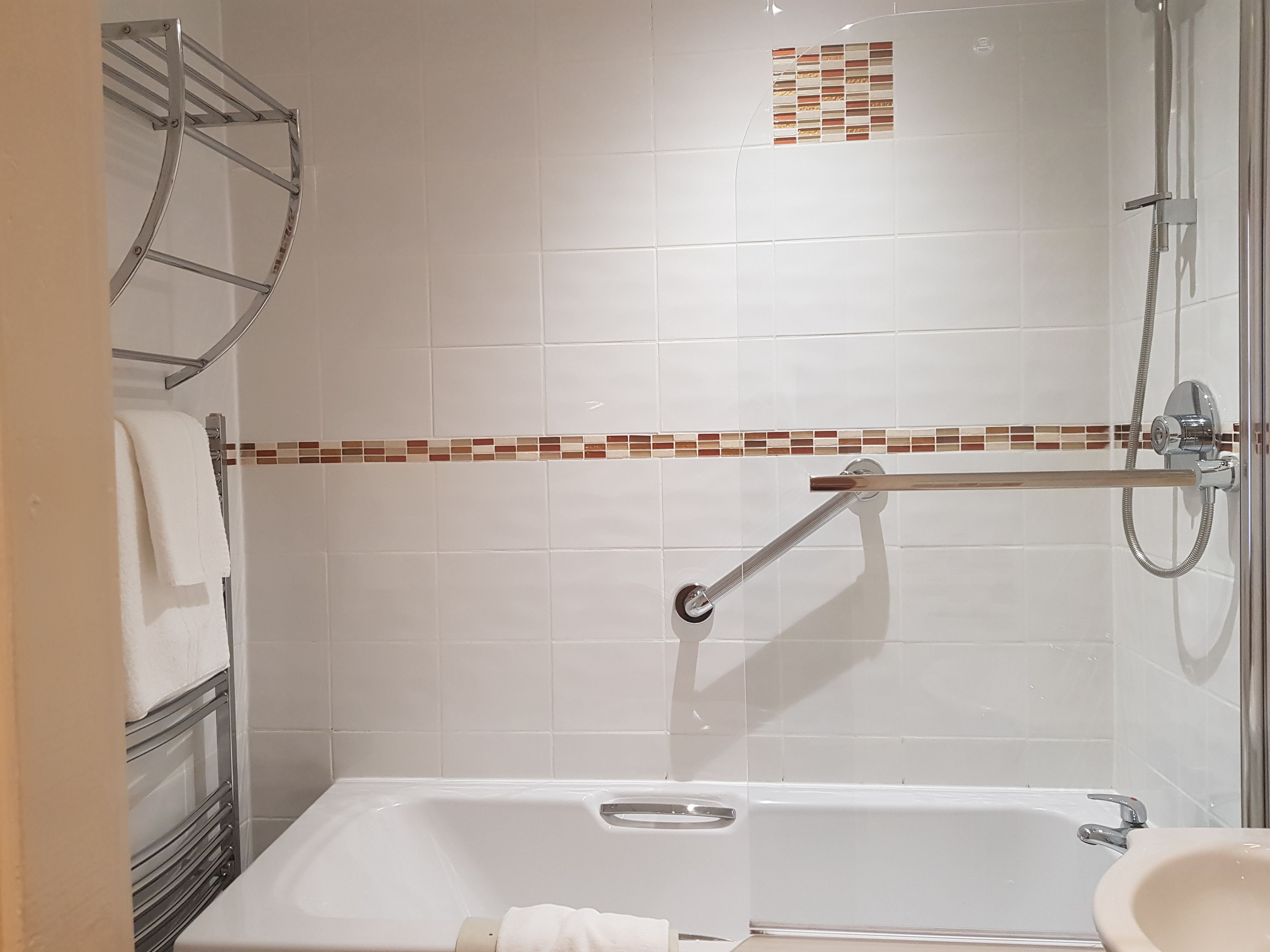 separate bathtub and shower, eco-friendly toiletries, hair dryer, towels