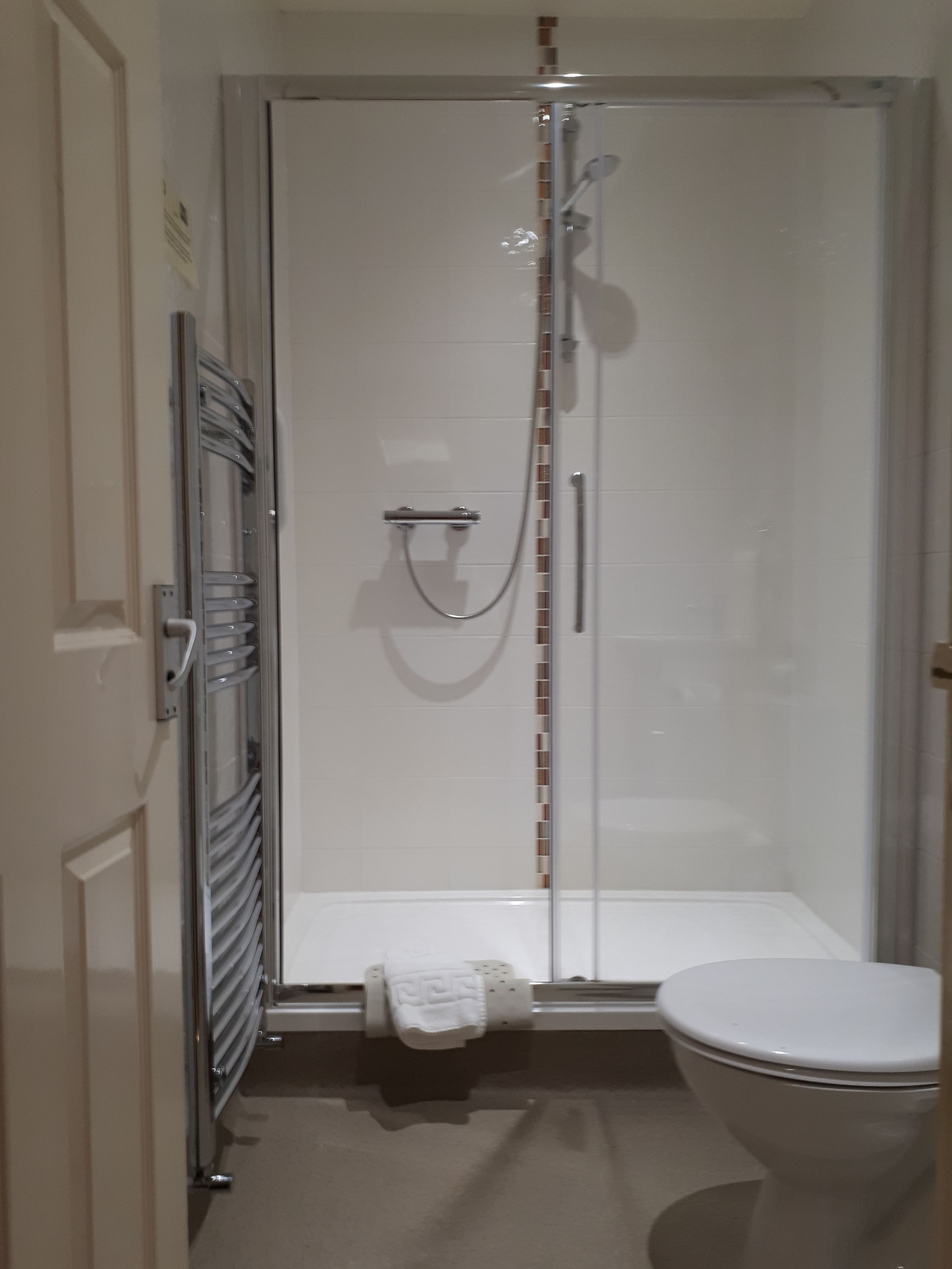 separate bathtub and shower, eco-friendly toiletries, hair dryer, towels
