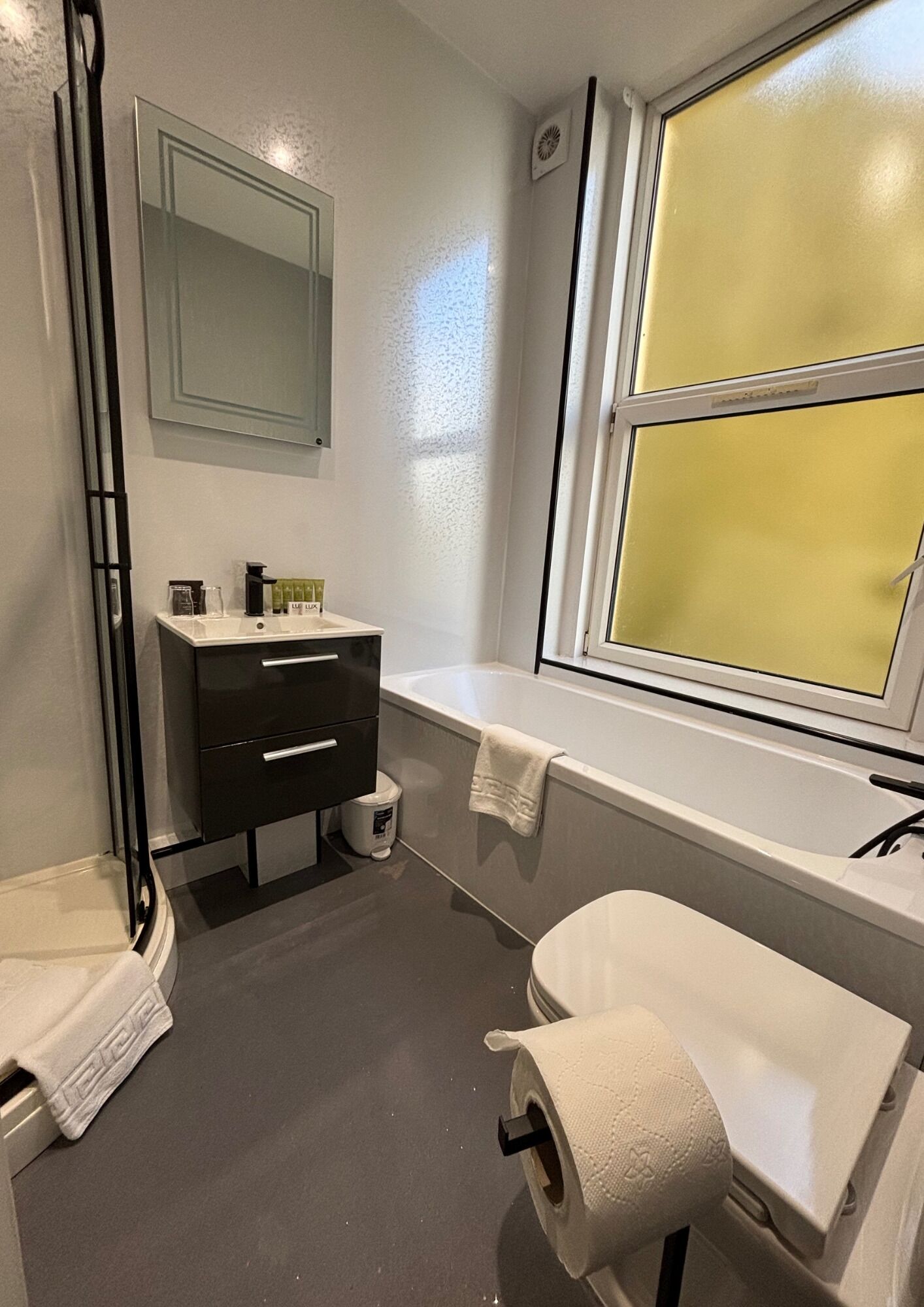 premium apartment | bathroom | separate bathtub and shower, eco-friendly toiletries, hair dryer, towels