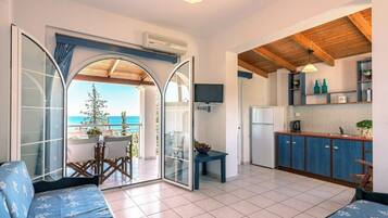 Apartment, Sea View | Private kitchen | Fridge, stovetop, electric kettle, cookware/dishes/utensils