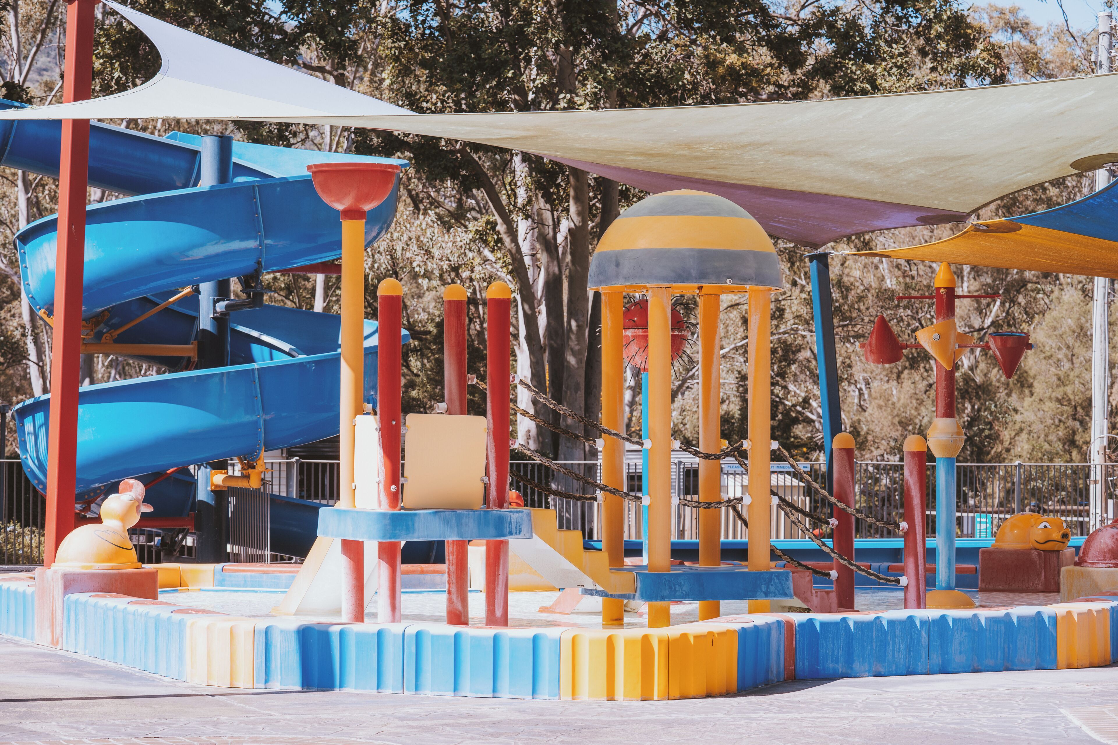 A playground with slides and climbing structures.