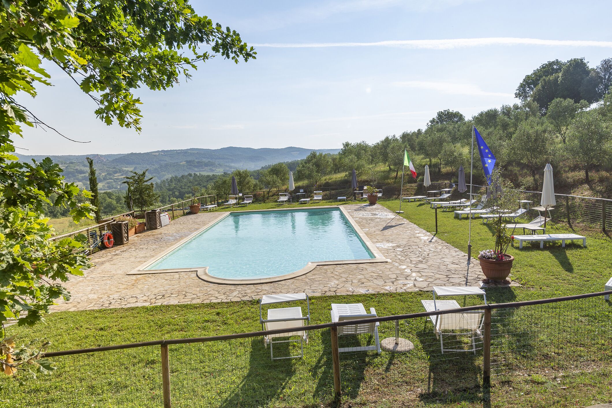 seasonal outdoor pool, a rooftop pool, pool umbrellas, pool loungers
