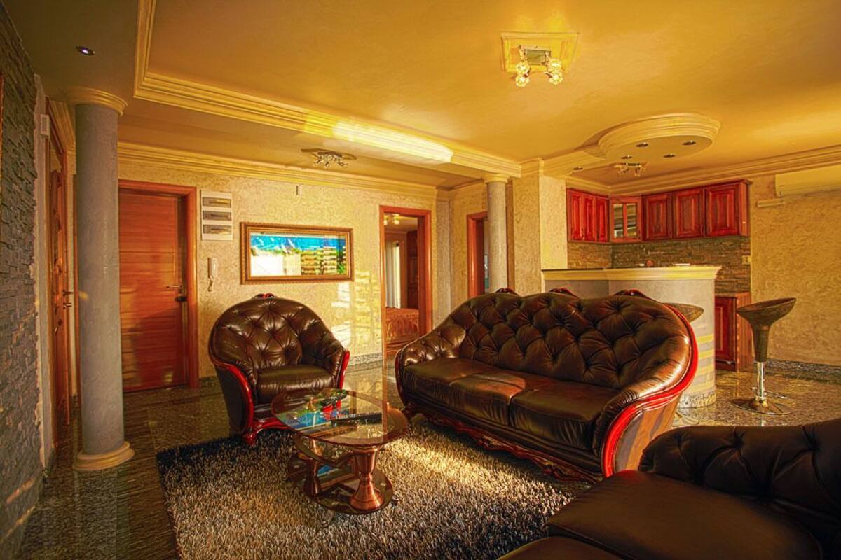 Deluxe Apartment, Sea View | Living area | Flat-screen TV