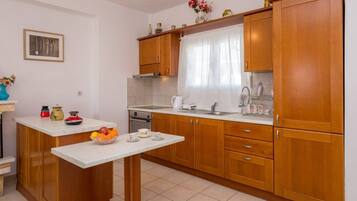 Apartment, 2 Bedrooms | Private kitchen | Full-size fridge, oven, stovetop, coffee/tea maker