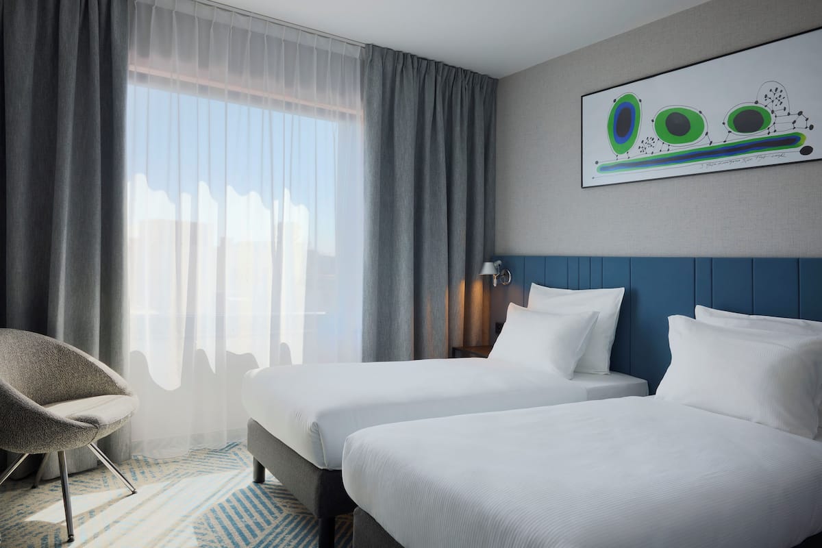 Standard Twin Room | Minibar, in-room safe, desk, laptop workspace