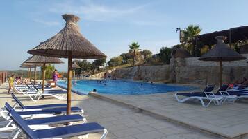 Seasonal outdoor pool, pool umbrellas, pool loungers