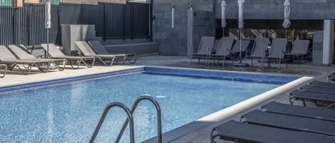 Indoor pool, outdoor pool, open 10:00 AM to 7 PM, pool umbrellas