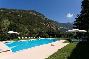 Seasonal outdoor pool, pool umbrellas, pool loungers