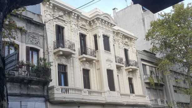 A historic building with ornate architectural details, multiple balconies, and a classic facade. - Claridge Hotel (Montevideo)