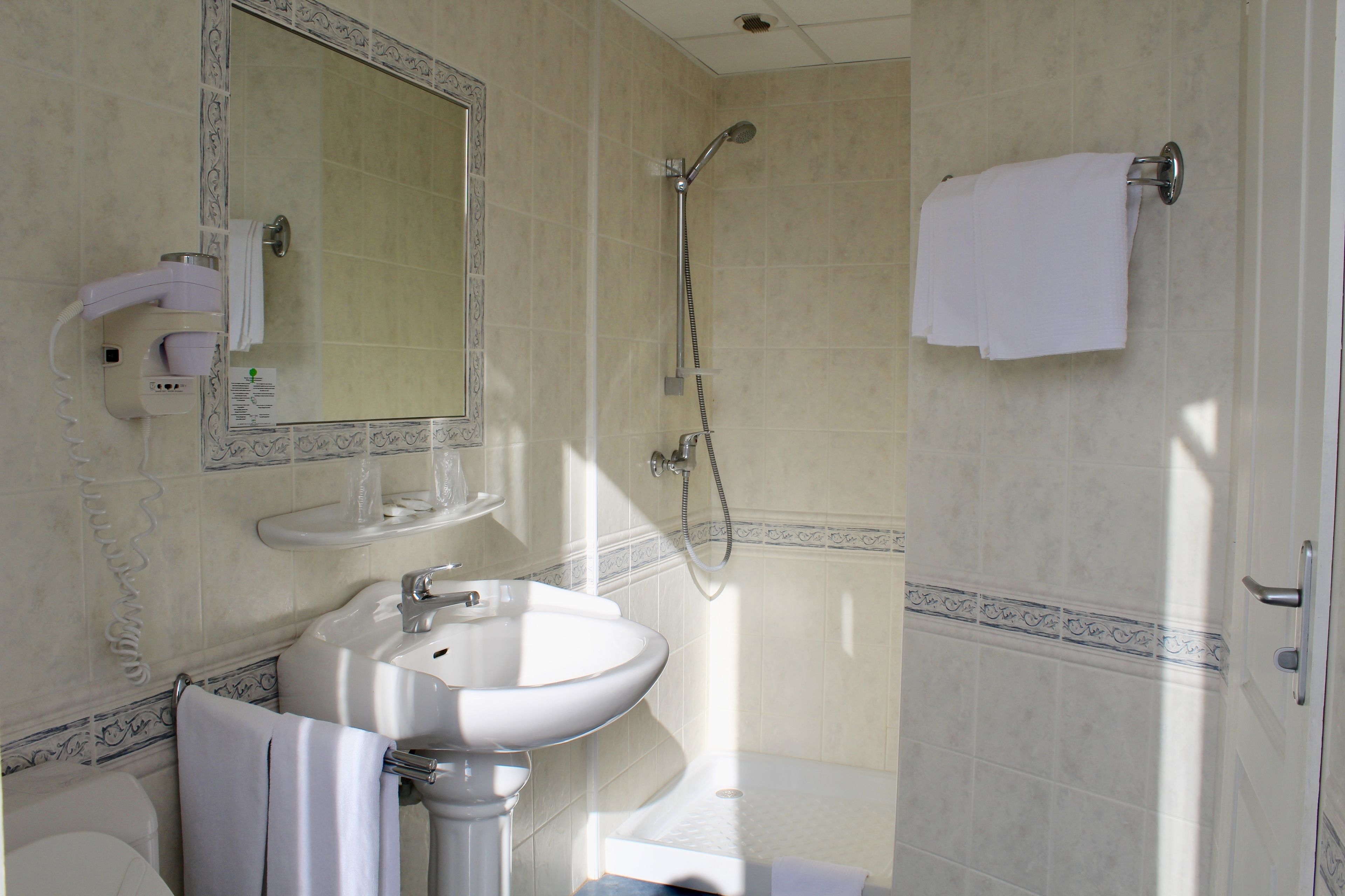 shower, free toiletries, hair dryer, towels