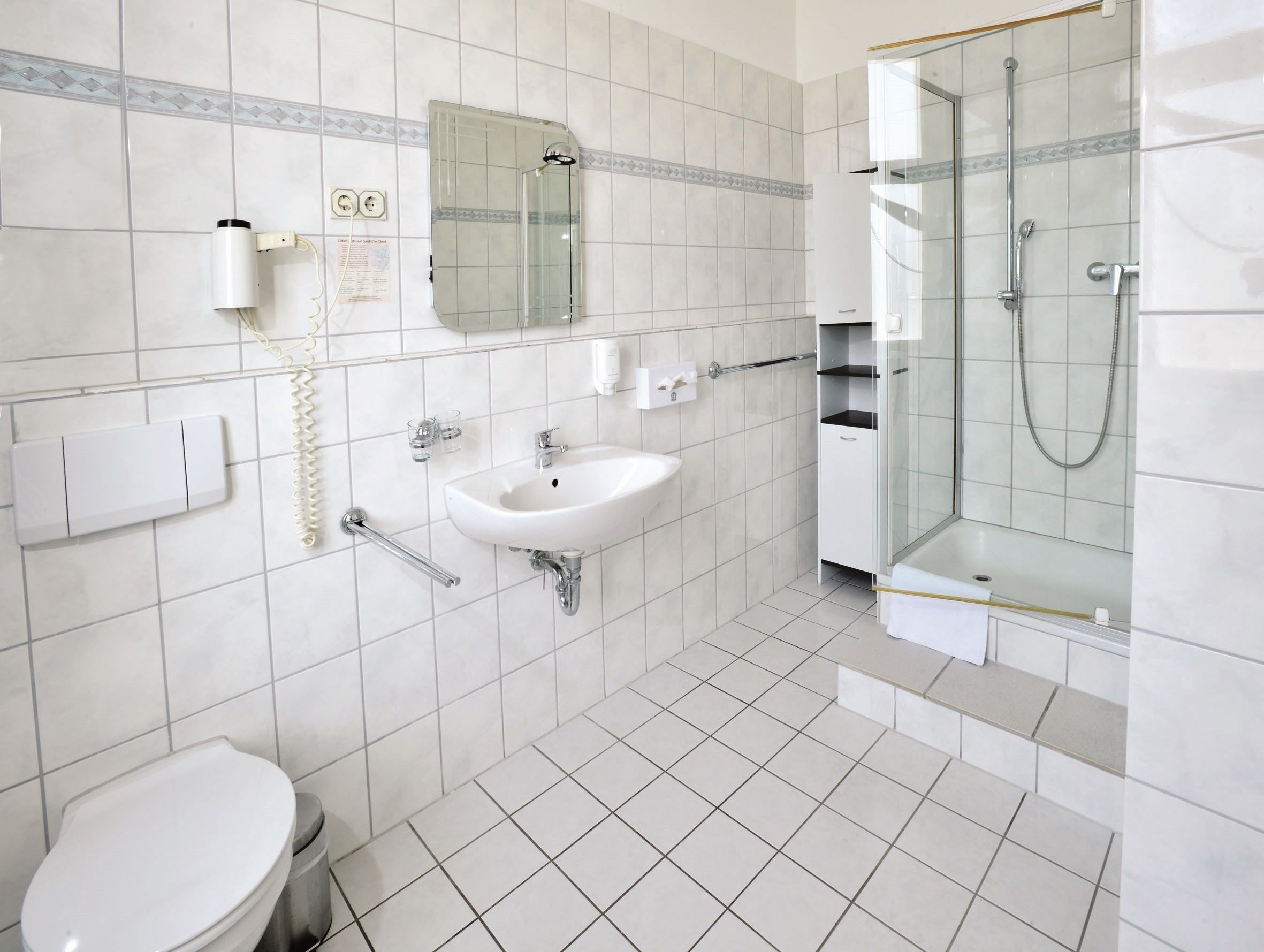comfort double room (disability access) | bathroom | shower, free toiletries, hair dryer, towels