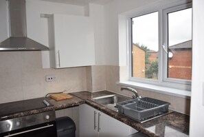 Apartamento, 1 quarto | Cozinha privada | Geladeira grande, micro-ondas, fogão
