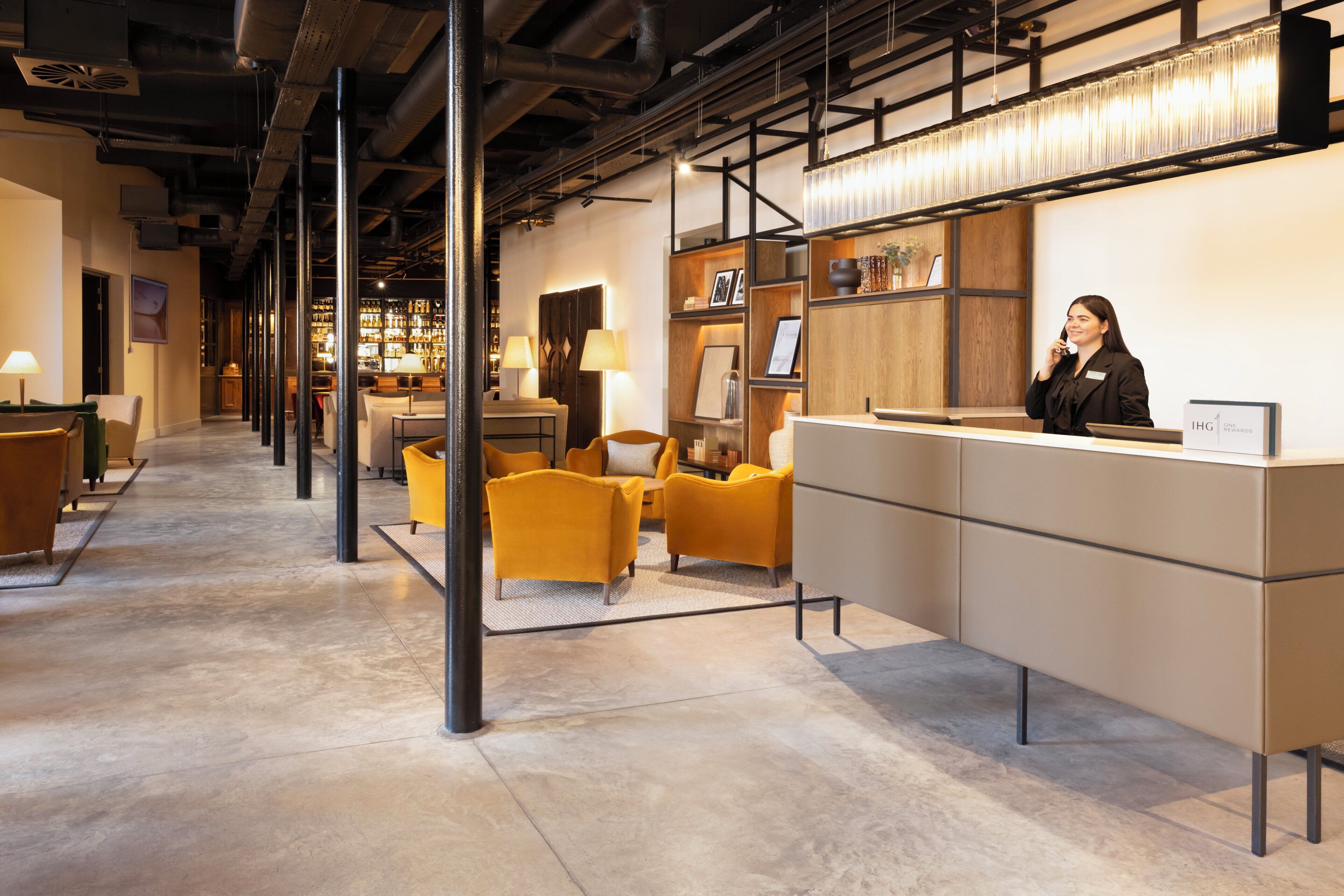 A reception area with a counter, a bar, and seating.