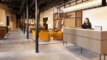 A reception area with a counter, a bar, and seating.
