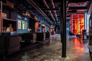 A spacious bar area with seating and a view of the cityscape. - Hotel Indigo Dundee by IHG (Dundee)