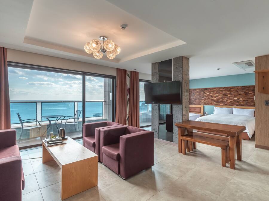 7. Family Triple Ocean | Living area | 65-inch Smart TV with digital channels, Netflix, streaming services