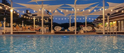 Seasonal outdoor pool, open 3:00 PM to 8:00 PM, pool umbrellas