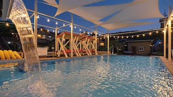Seasonal outdoor pool, open 3:00 PM to 8:00 PM, pool umbrellas