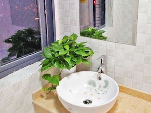 Shower, hair dryer, slippers, towels
