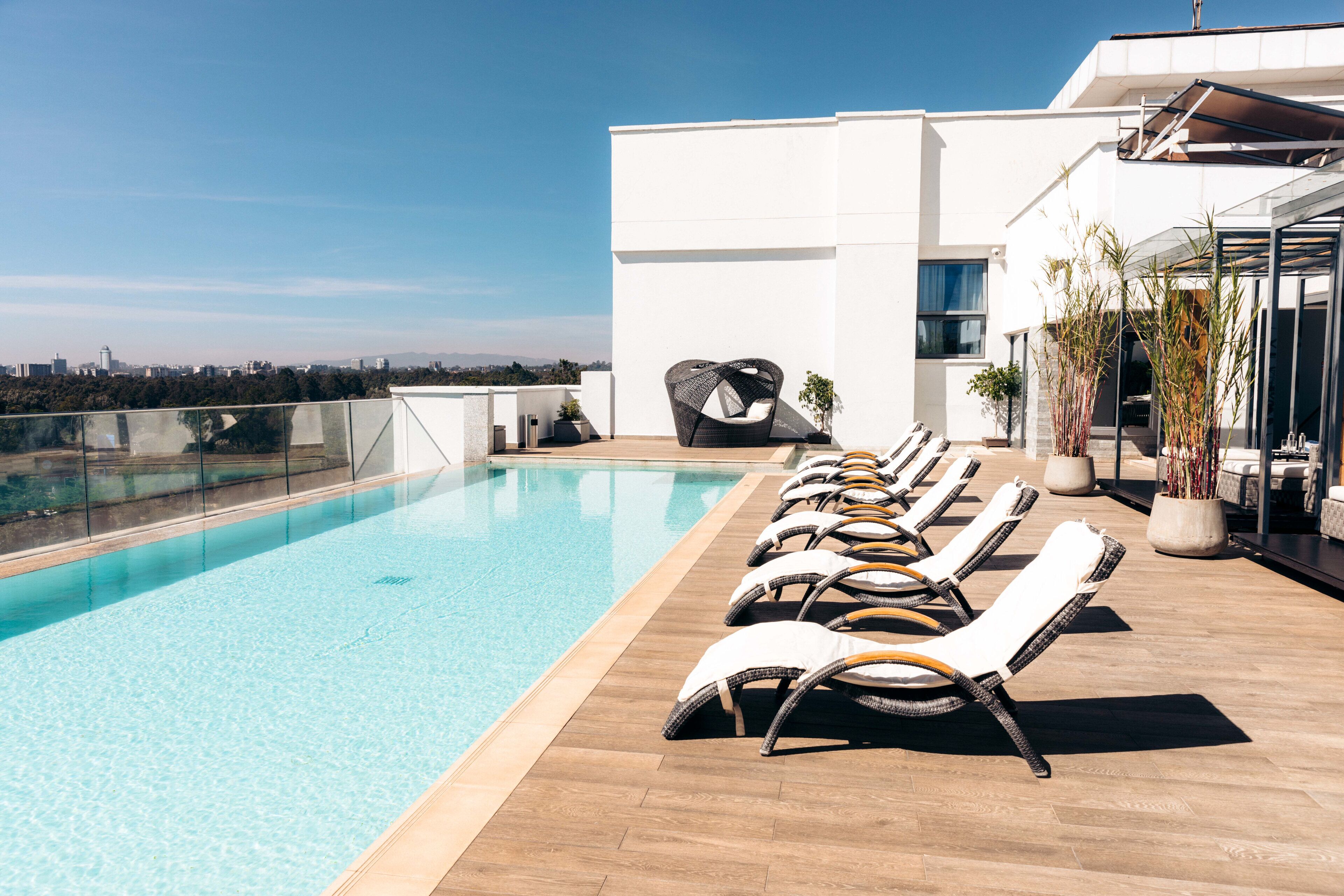 outdoor pool, open 6:00 am to 6:00 pm, free pool cabanas, pool umbrellas