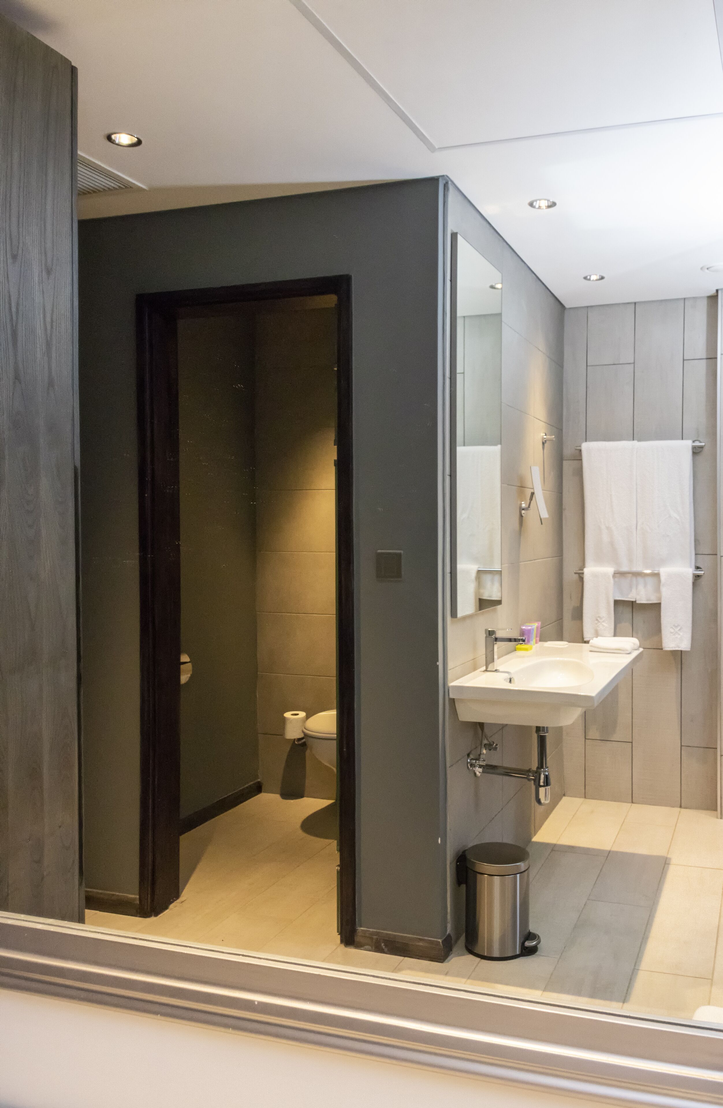 shower, hair dryer, slippers, towels