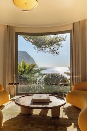 Signature Suite (Duplex) | Living area | 80-cm flat-screen TV with cable channels, TV, tablet