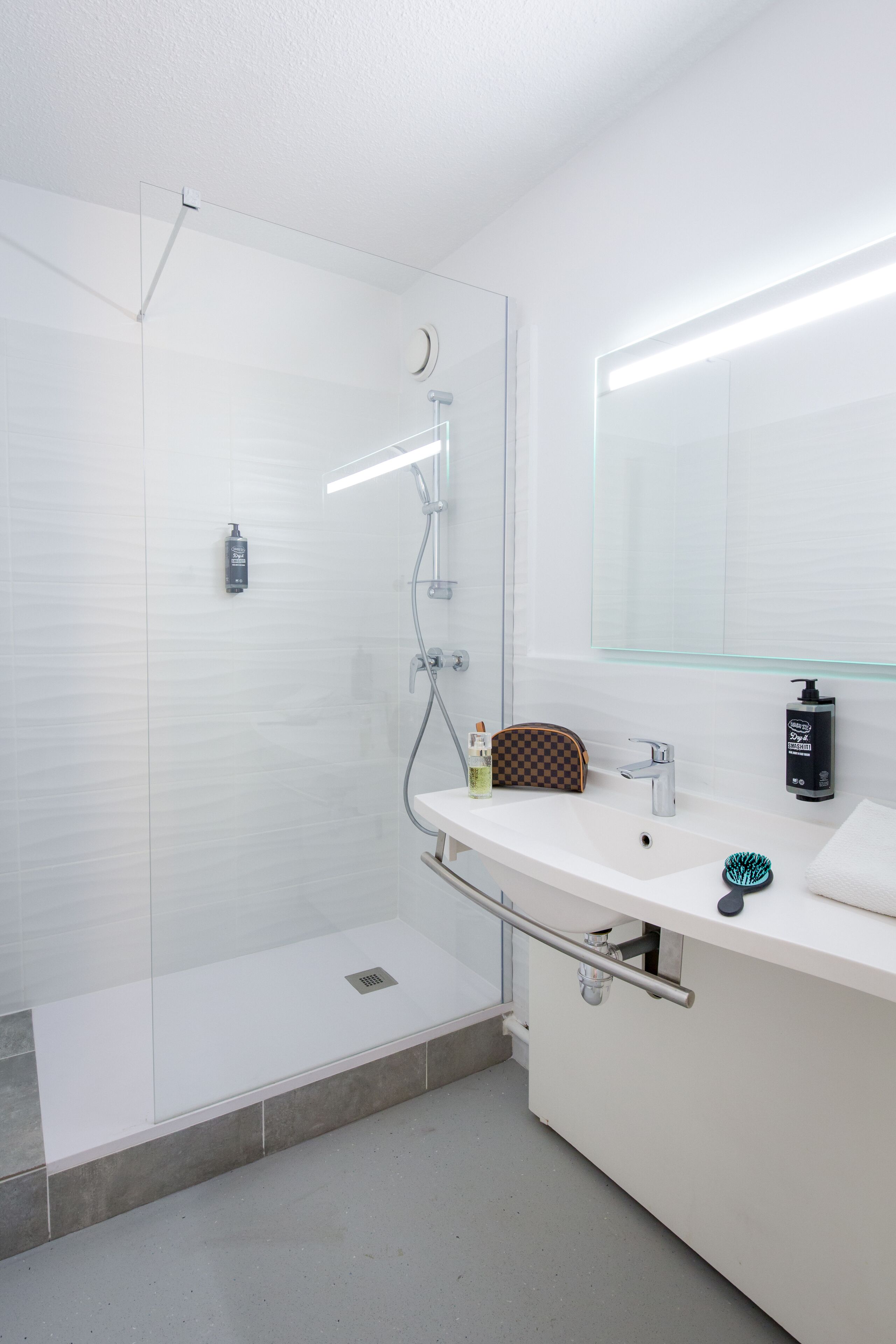 shower, rainfall showerhead, eco-friendly toiletries, towels