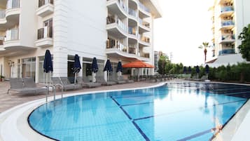 Seasonal outdoor pool, pool umbrellas, sun loungers