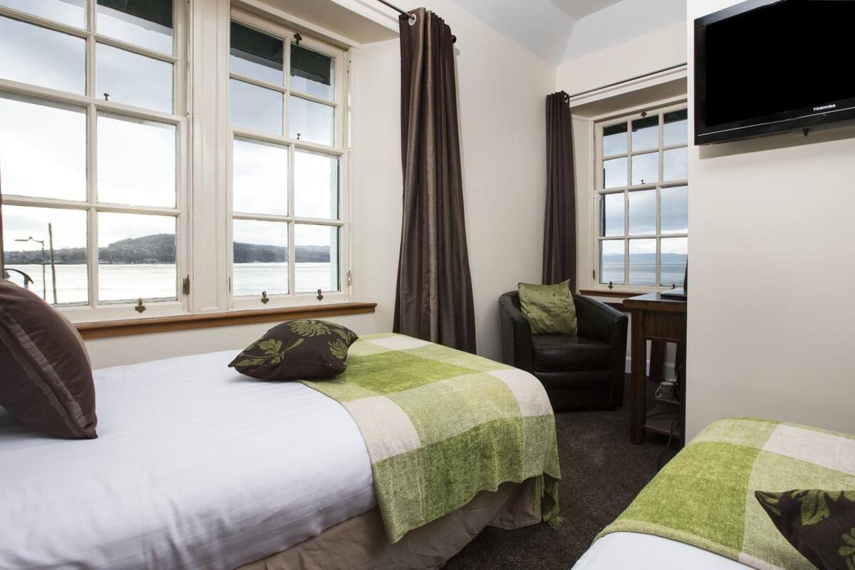 premium bedding, desk, blackout curtains, iron/ironing board