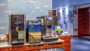 A coffee station with two espresso machines and a menu board. - Hotel Cloud Arena-Daan (Taipei)