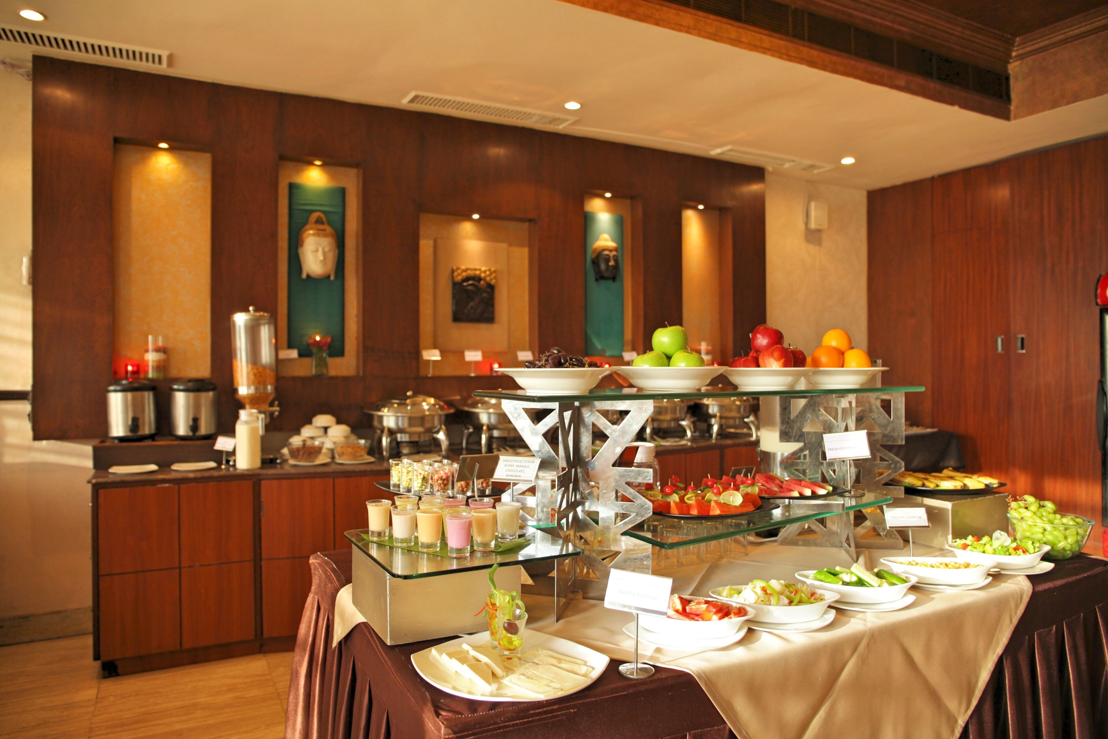 A buffet with various food items and a coffee station.